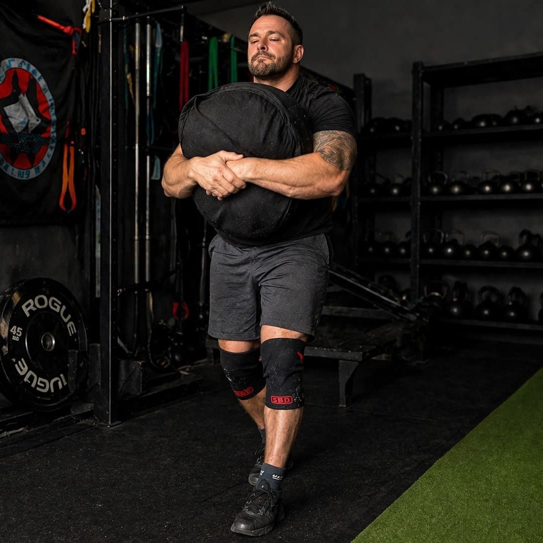 strongman sandbag carry