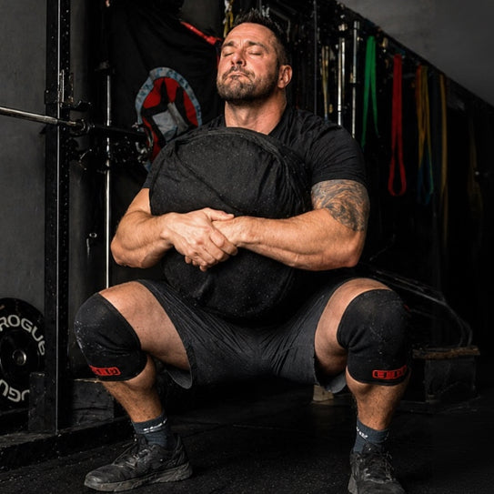 strongman sandbag squat